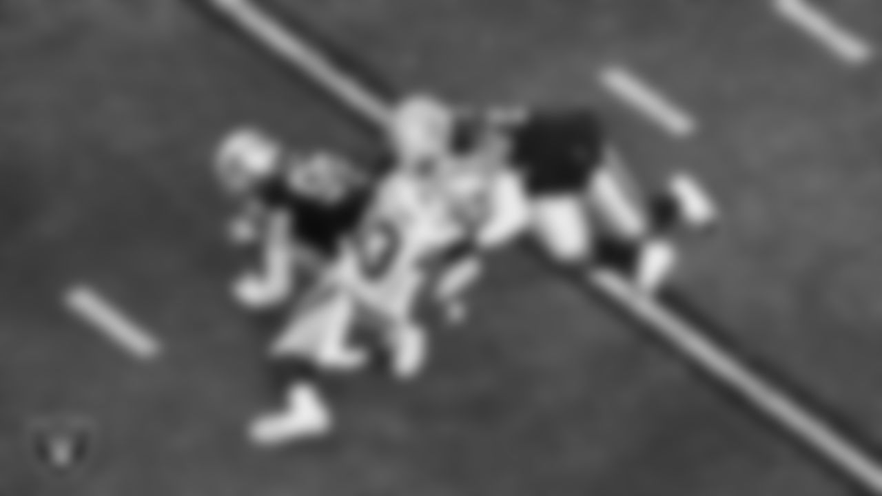 Las Vegas Raiders linebacker Elandon Roberts (52) makes a tackle during the regular season home game against the Dallas Cowboys at Allegiant Stadium.