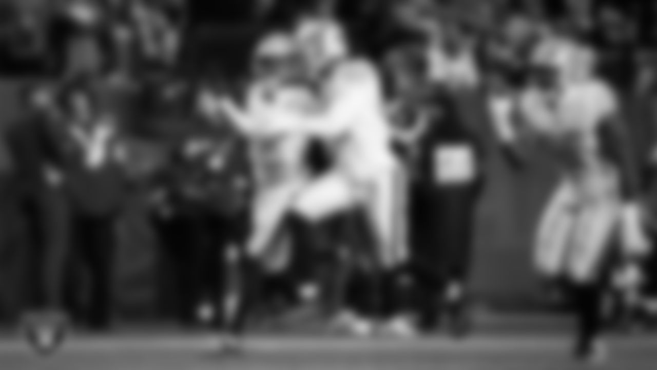 Las Vegas Raiders cornerback Kyu Blu Kelly (36) celebrates with teammates after intercepting a pass during the regular season away game against the Denver Broncos at Empower Field at Mile High.