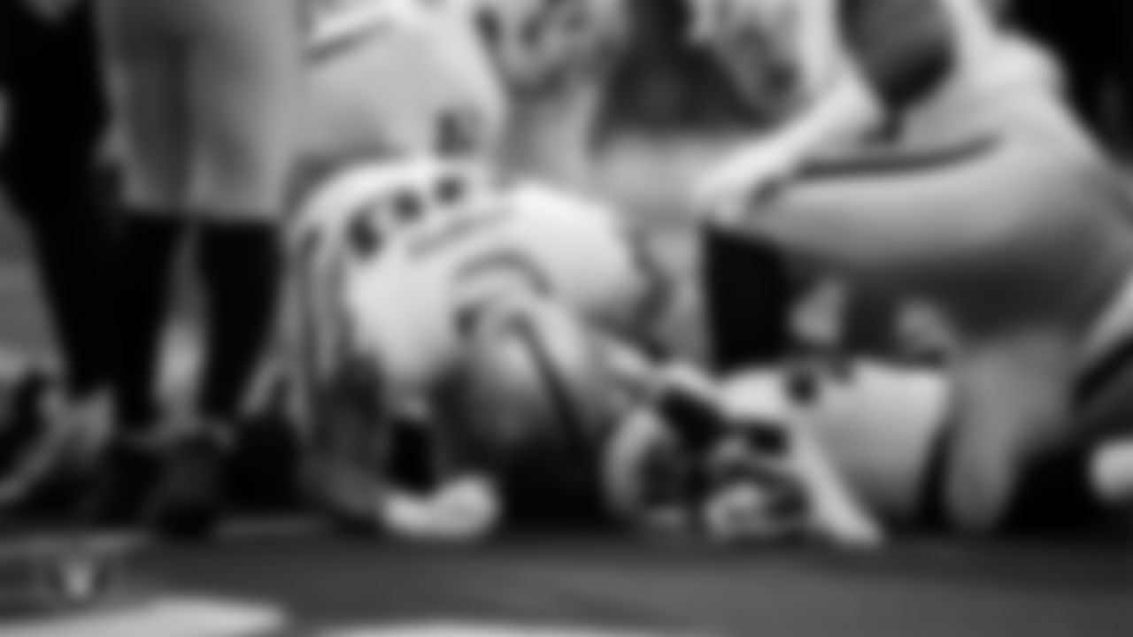 Las Vegas Raiders defensive end Maxx Crosby (98) and linebacker Devin White (45) make a tackle during the regular season away game against the Los Angeles Chargers at SoFi Stadium.