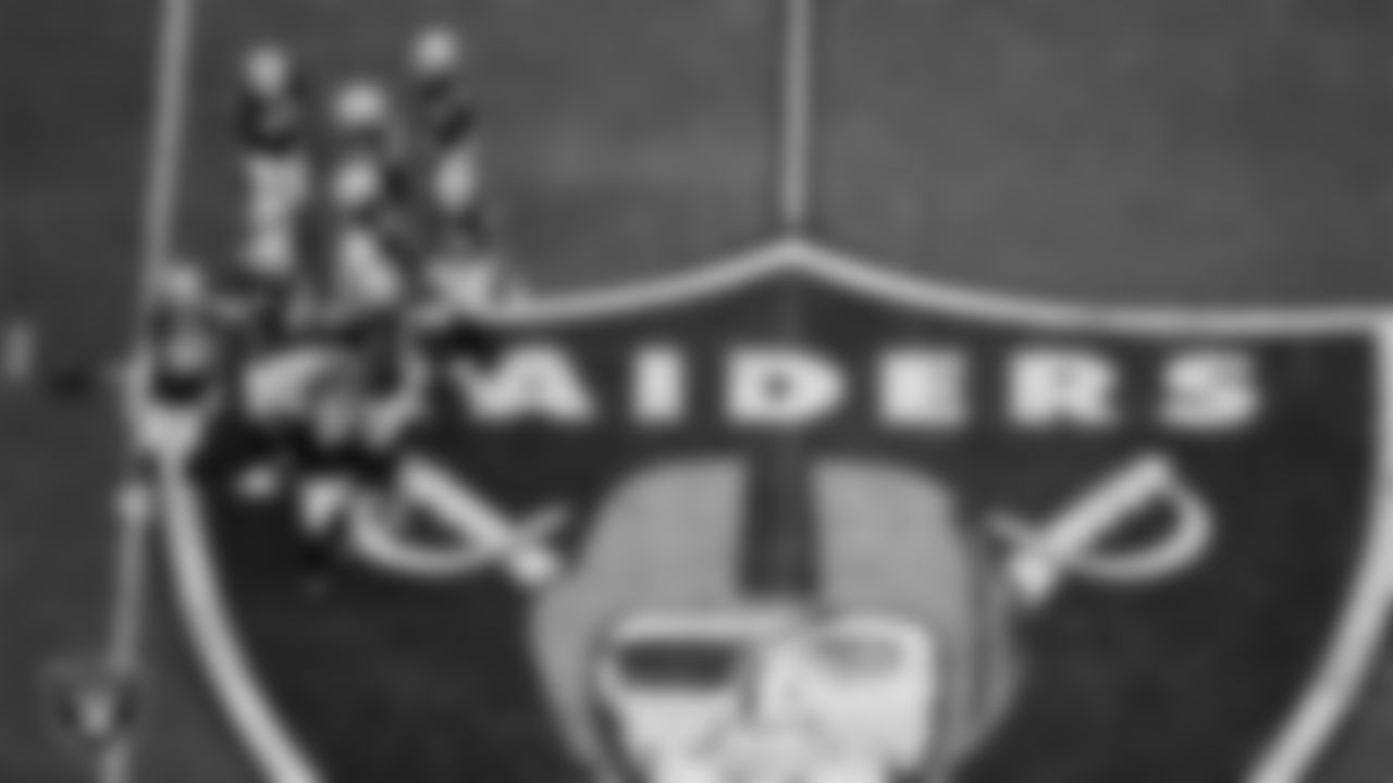 The Las Vegas Raiders defense huddles during the regular season home game against the Denver Broncos at Allegiant Stadium.