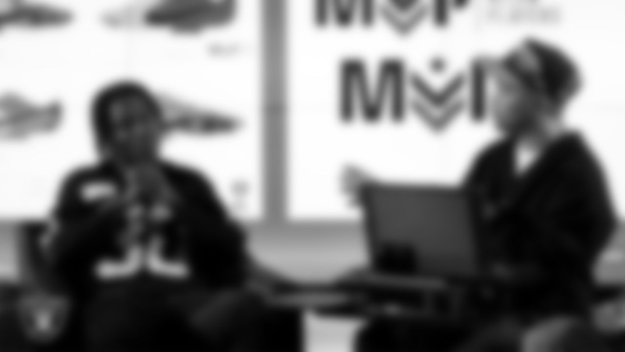 Las Vegas Raiders cornerback Darnay Holmes (30) works with representatives from Merging Vets and Players and designers to design cleats for My Cause My Cleats in Cox Studios at Intermountain Health Performance Center.