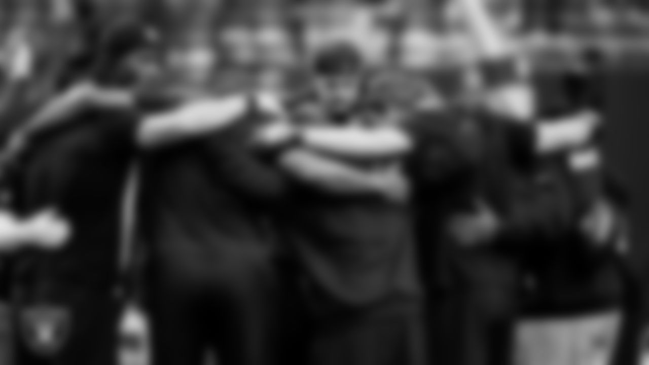 The Las Vegas Raiders wide receivers and quarterbacks huddle before the regular season home game against the Cleveland Browns at Allegiant Stadium.