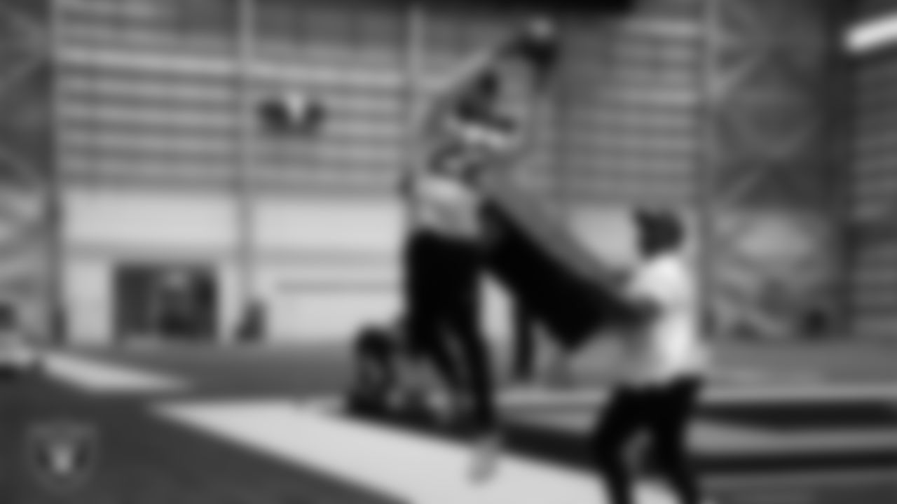 Las Vegas Raiders cornerback Eric Stokes (22) and pass game coordinator/defensive backs coach Joe Woods during practice at Intermountain Health Performance Center.