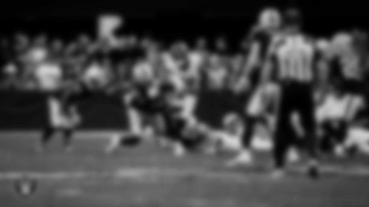 Las Vegas Raiders cornerback Darien Porter (26) makes a tackle during the regular season home game against the Denver Broncos at Allegiant Stadium.