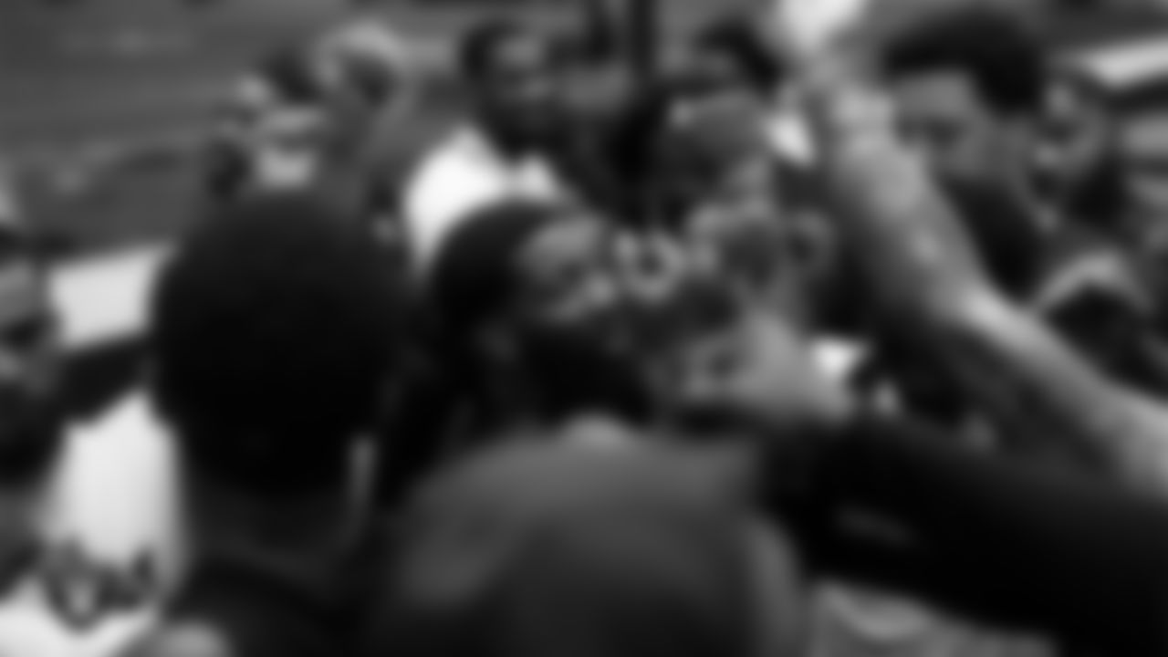 The Las Vegas Raiders huddle at a workout during phase one of the offseason program at Intermountain Health Performance Center.
