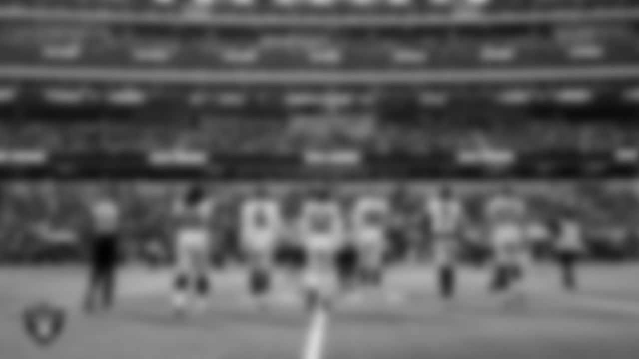 The Las Vegas Raiders walk out to the center of the field for the coin toss before the regular season away game against the the Los Angeles Chargers at SoFi Stadium.