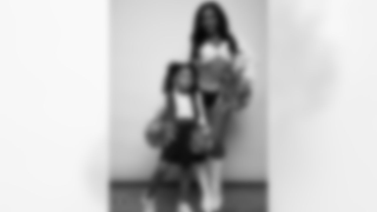 Raiderette Cierra poses for a photo with a Junior Raiderette during 2025 Media Day at The Studio.