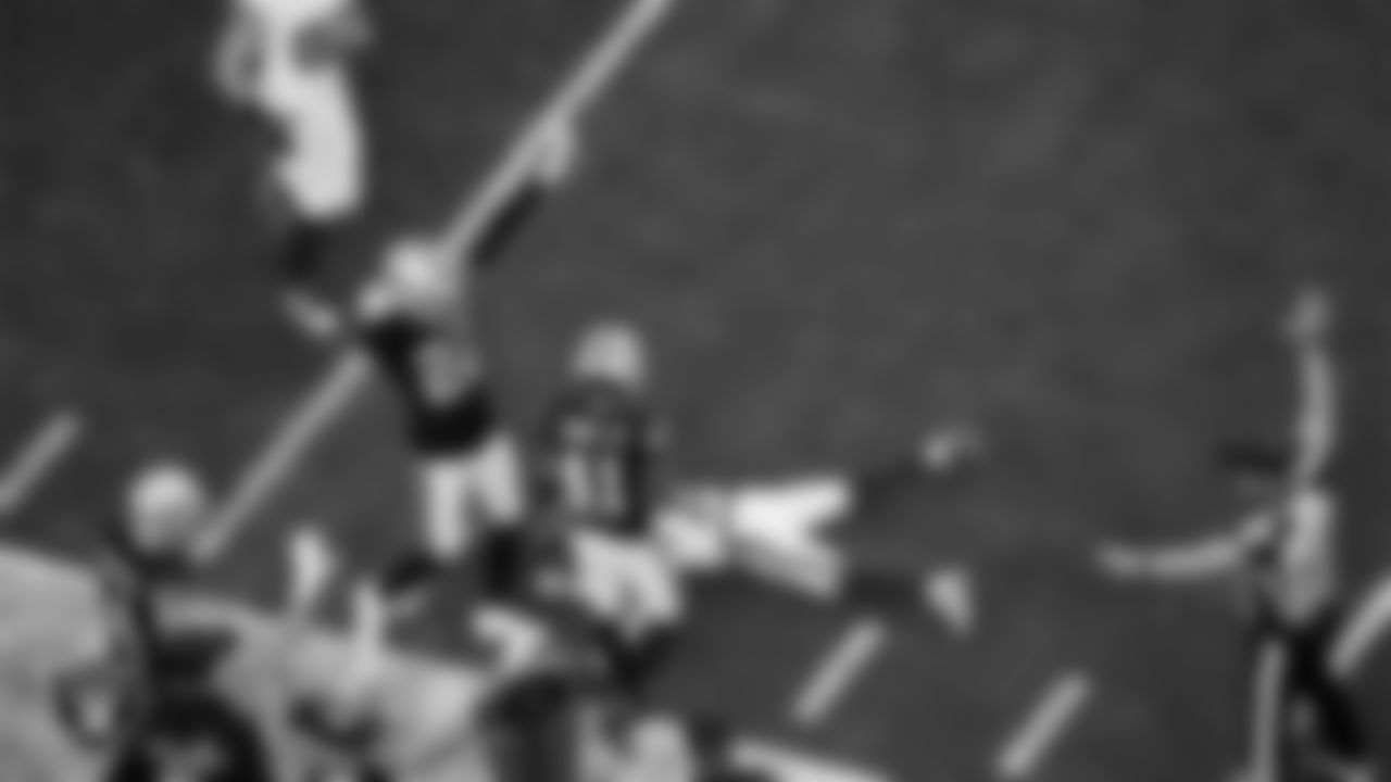 Las Vegas Raiders cornerback Greedy Vance (41) celebrates with teammates after breaking up a pass during the regular season home game against the New York Giants at Allegiant Stadium.