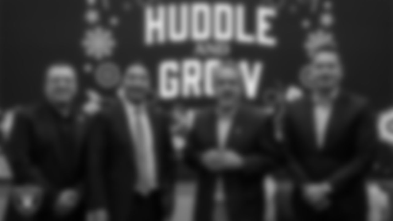 DJ Hector Minjarez and speakers Giovanni Alonso, Peter Guzman and Jonathan Martinez pose for a photo during the Huddle and Grow event at Las Vegas Raiders Headquarters.