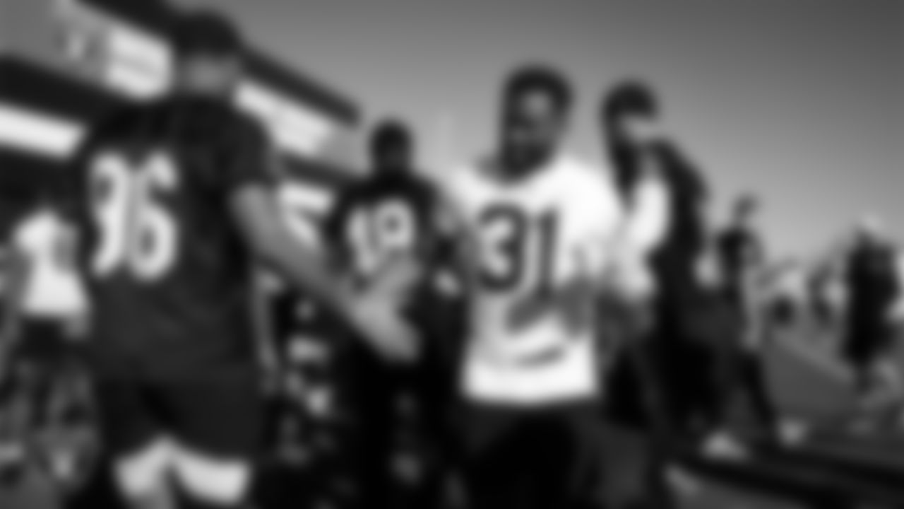 Las Vegas Raiders defensive tackle Jonah Laulu (96) and running back Raheem Mostert (31) during practice at Intermountain Health Performance Center.