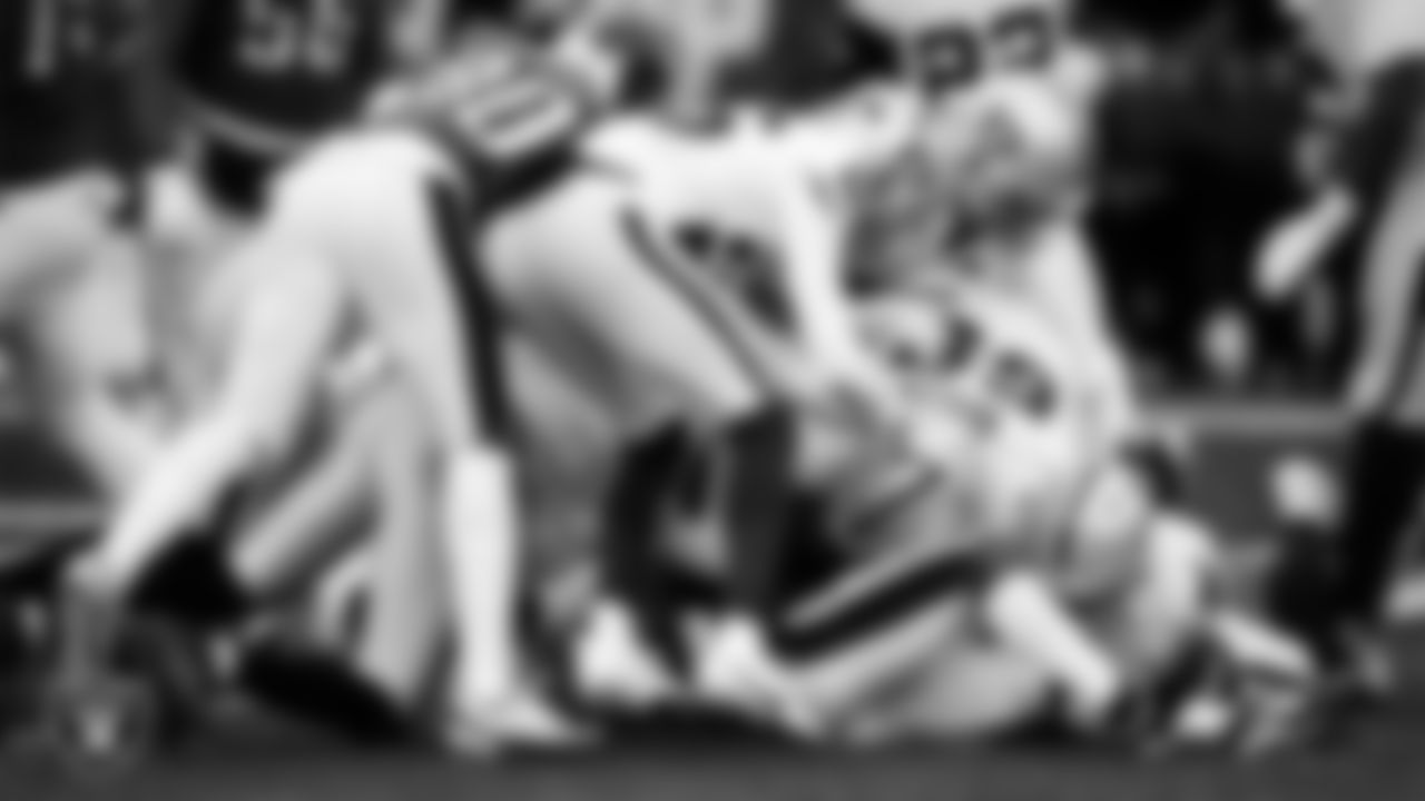 The Las Vegas Raiders defense makes a tackle during the regular season away game against the Philadelphia Eagles at Lincoln Financial Field.