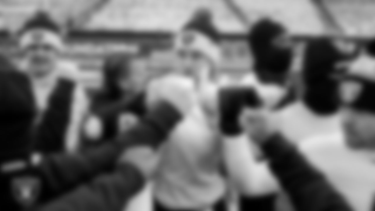 The Las Vegas Raiders quarterbacks and wide receivers huddle before the regular season away game against the Philadelphia Eagles at Lincoln Financial Field.