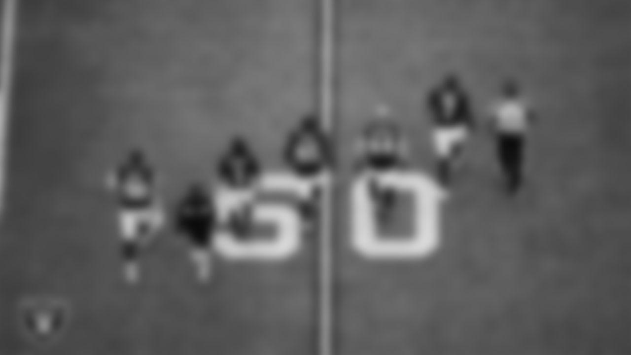 The Las Vegas Raiders walk out to the center of the field for the coin toss before the regular season home game against the the Chicago Bears at Allegiant Stadium.