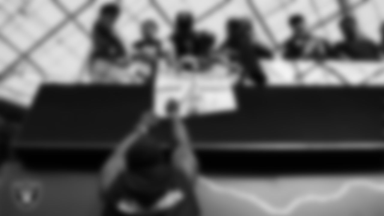 Las Vegas Raiders linebacker Devin White (45) signs autographs for fans before the regular season away game against the Los Angeles Chargers at SoFi Stadium.