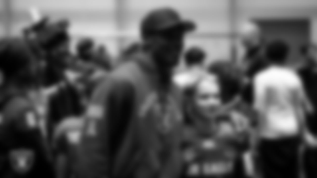 Las Vegas Raiders wide receiver Phillip Dorsett II (13) poses for a photo with an athlete during an open practice at Intermountain Health Performance Center.