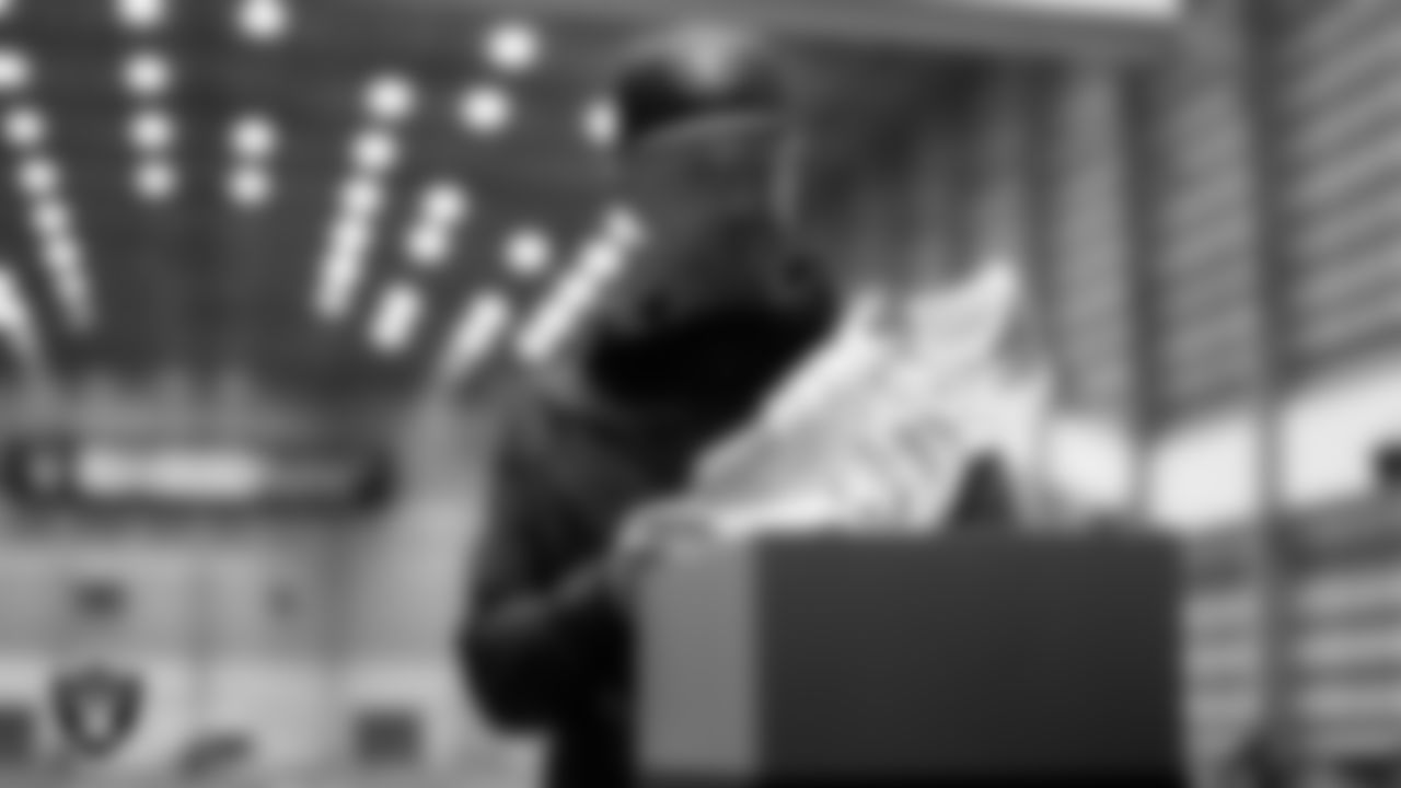 Las Vegas Raiders General Manager John Spytek unboxes his custom cleats for the NFL's My Cause My Cleats initiative at Intermountain Health Performance Center.