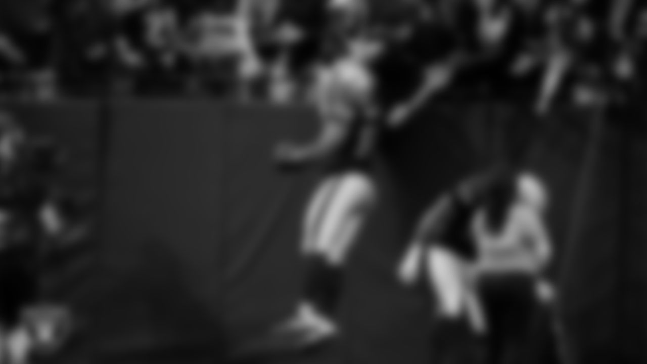 Las Vegas Raiders defensive tackle Thomas Booker IV (99) celebrates after recovering a fumble during the regular season home game against the Tennessee Titans at Allegiant Stadium.