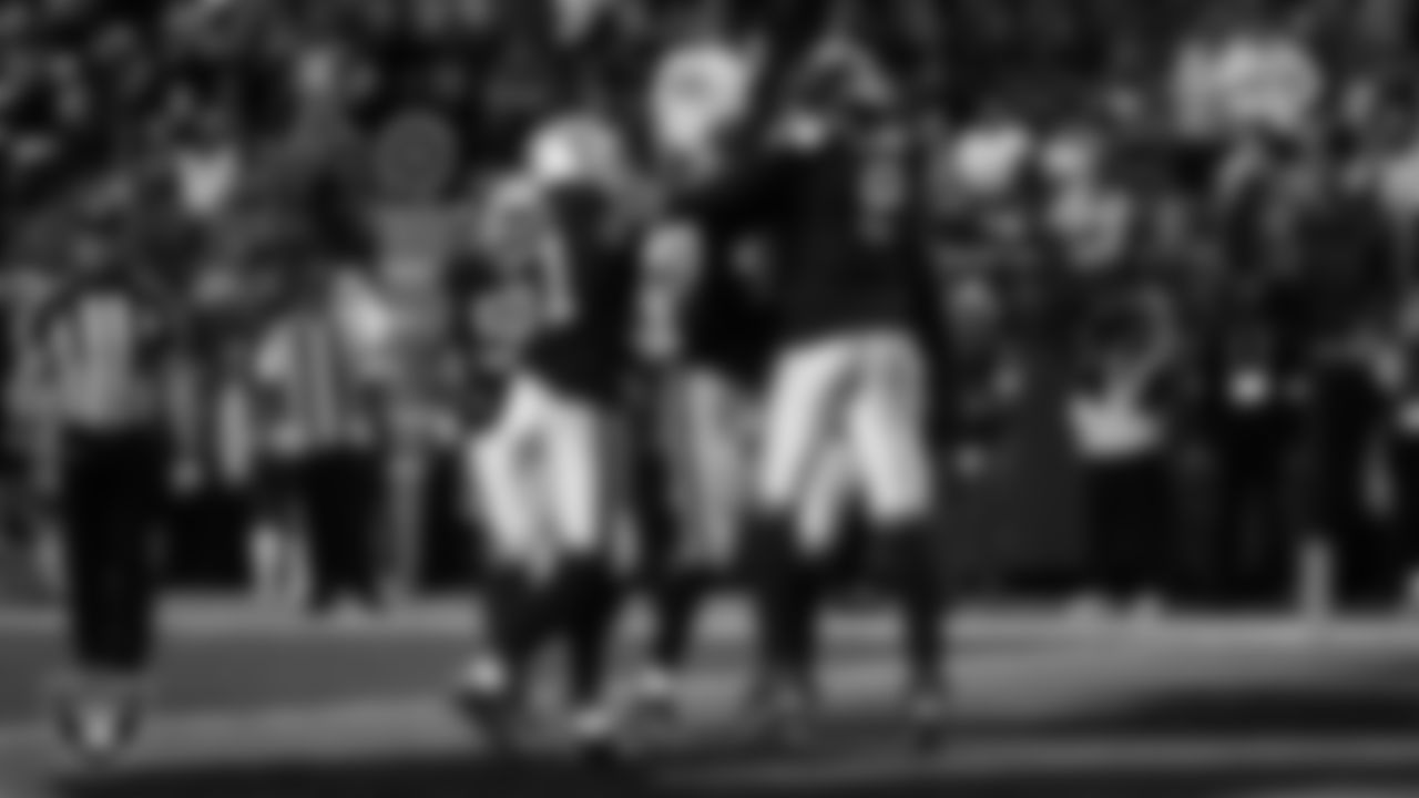 Las Vegas Raiders defensive end Tyree Wilson (9) celebrates with teammates after sacking the quarterback for a safety during the regular season home game against the Kansas City Chiefs at Allegiant Stadium.