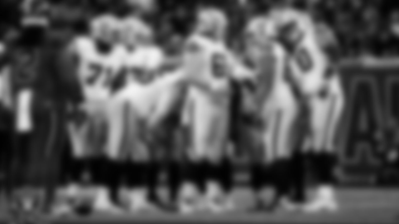 The Las Vegas Raiders offense huddles during the regular season away game against the Houston Texans at NRG Stadium.