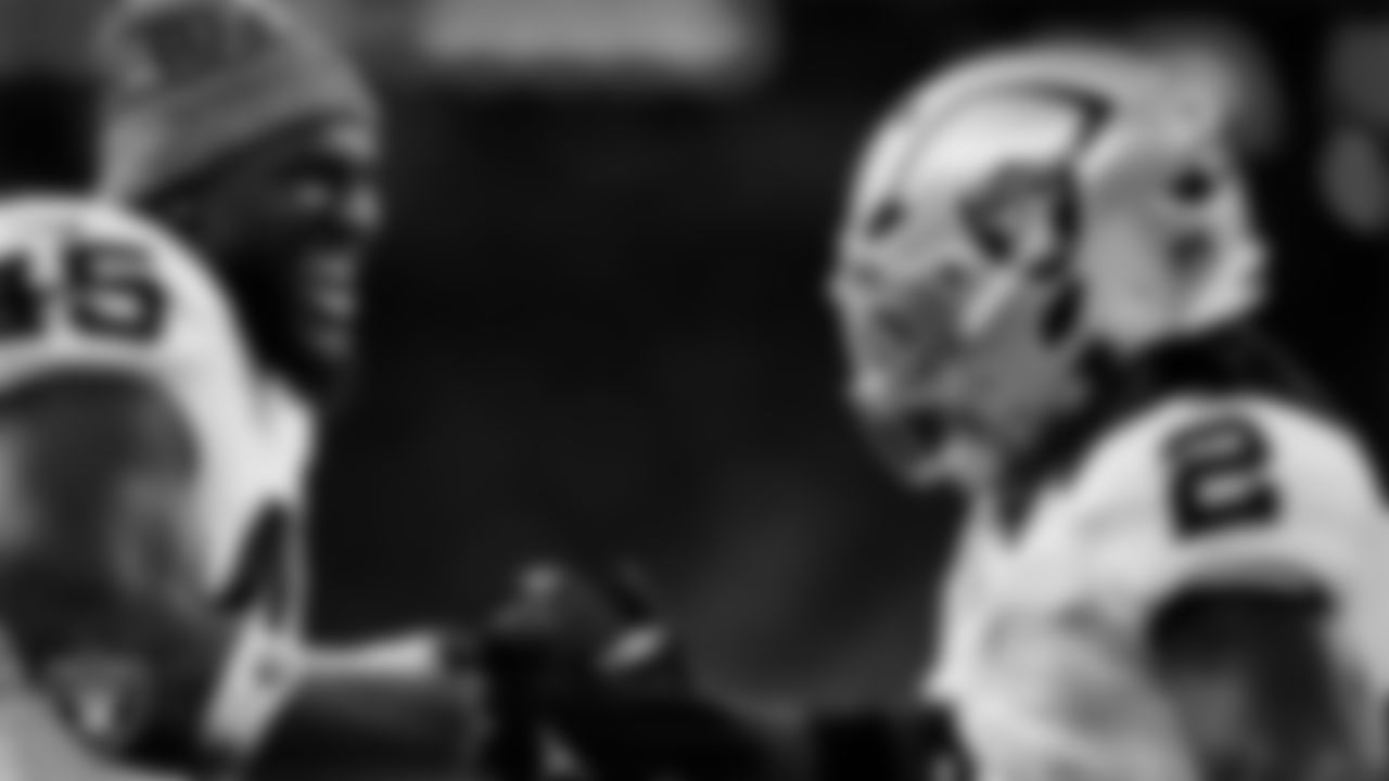 Las Vegas Raiders running back Ashton Jeanty (2) celebrates with linebacker Devin White (45) after making a 60-yard touchdown catch during the regular season away game against the Houston Texans at NRG Stadium.