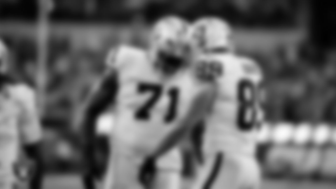 Las Vegas Raiders tight end Brock Bowers (89) celebrates with tackle DJ Glaze (71) after making a 6-yard touchdown catch during the regular season away game against the Los Angeles Chargers at SoFi Stadium.