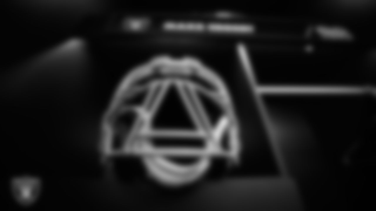 Las Vegas Raiders defensive end Maxx Crosby's (98) helmet in the locker room prior to the Raiders' arrival for their regular season home game against the Denver Broncos at Allegiant Stadium.