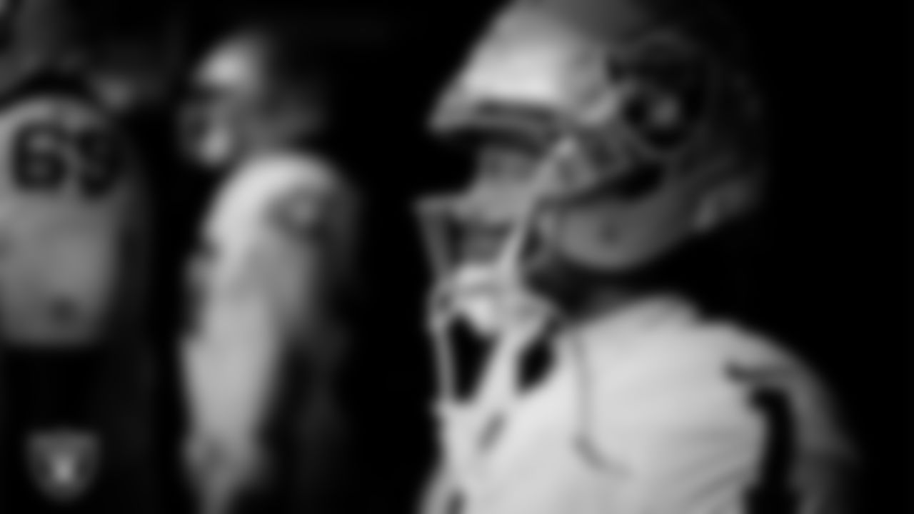 waits for the team to be introduced onto the field before the regular season away game against the Indianapolis Colts at Lucas Oil Stadium.