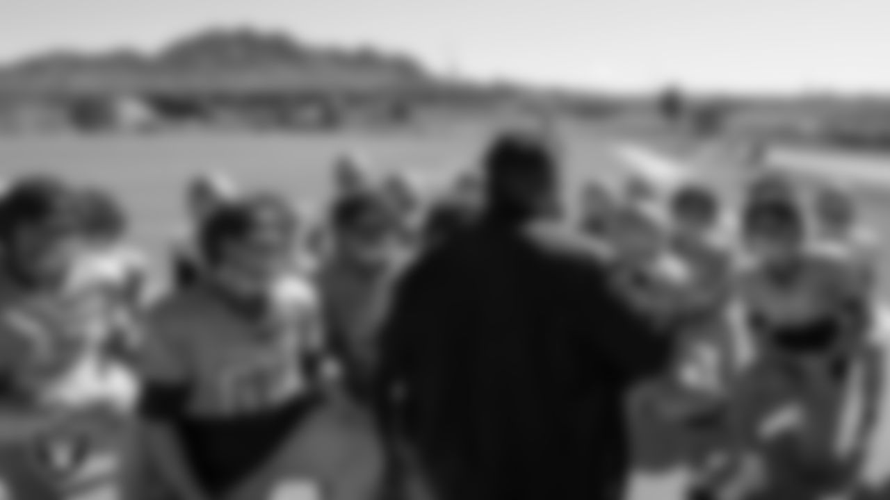 Las Vegas Raiders senior manager of football development Jordan Aguilar speaks to the Foothill High School football team during practice at Foothill High School.