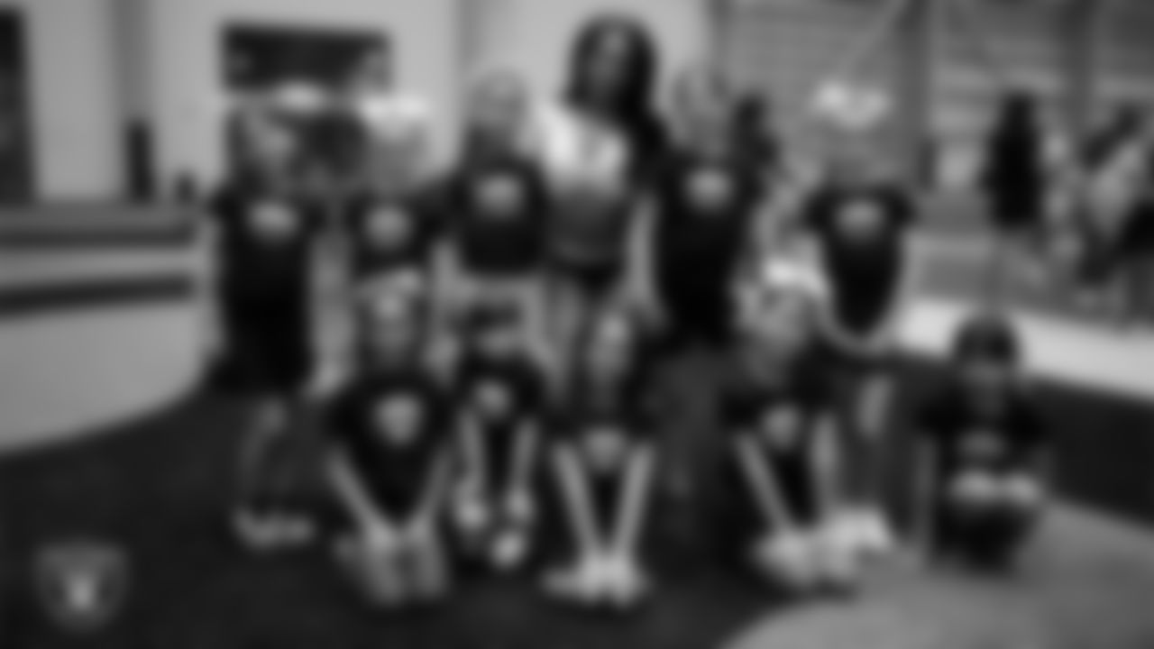 Raiderette Bria poses with dancers during day three of summer camp at Intermountain Health Performance Center.