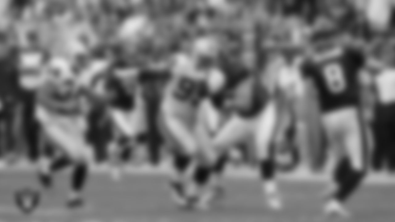 Oakland Raiders safety Mike Mitchell (34) and defensive end Lamarr Houston (99) during the regular season away game against the Houston Texans at NRG Stadium, Sunday, October 9, 2011, in Houston, Texas.