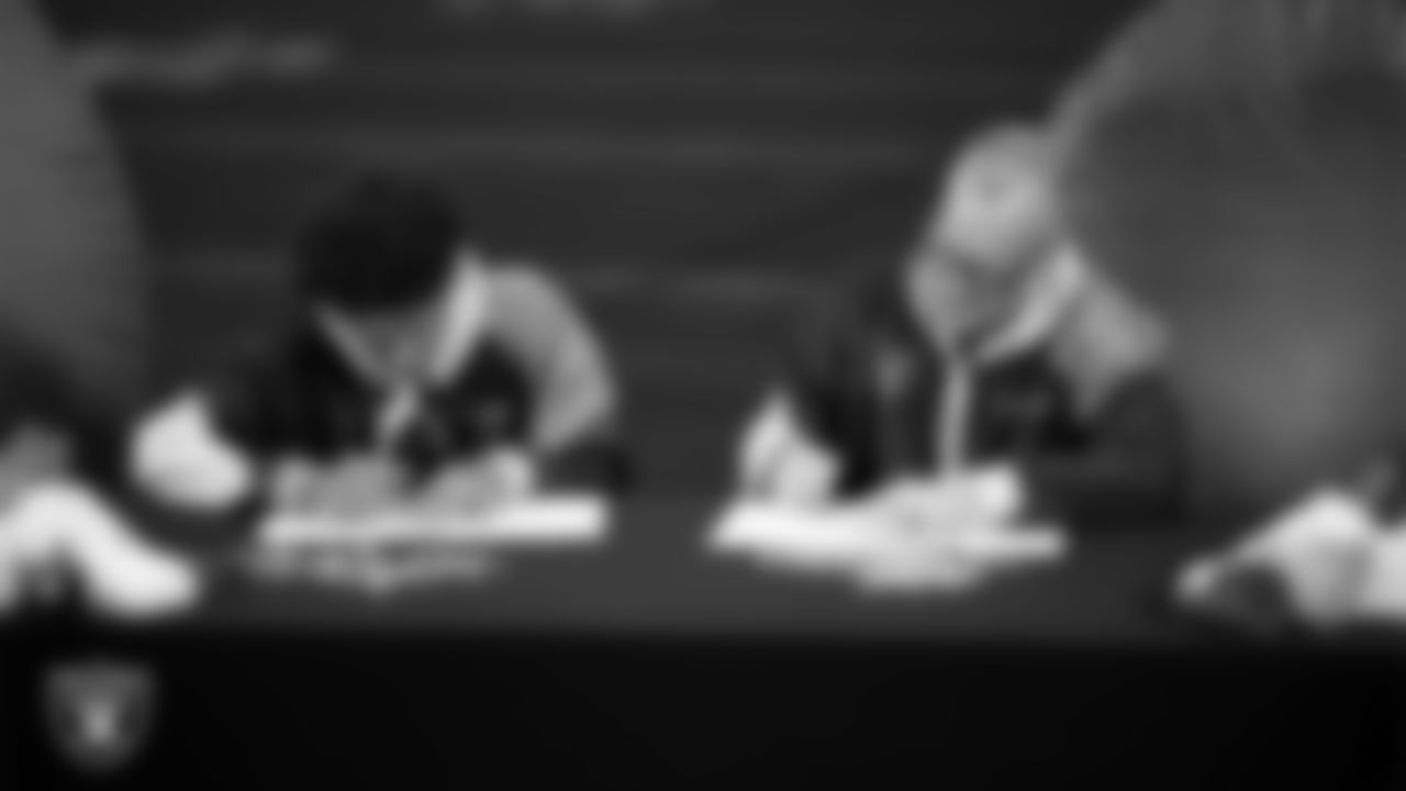 Intermountain Health Regional President Mitch Cloward designs custom shoes for My Cause My Cleats with Intermountain Children's Health patient Aiden at Intermountain Health Performance Center.