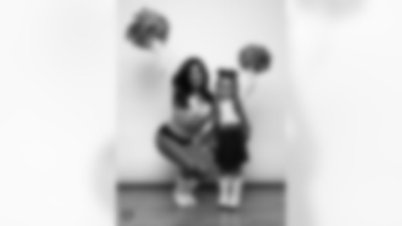 Raiderette Tatiana poses for a photo with a Junior Raiderette during 2025 Media Day at The Studio.