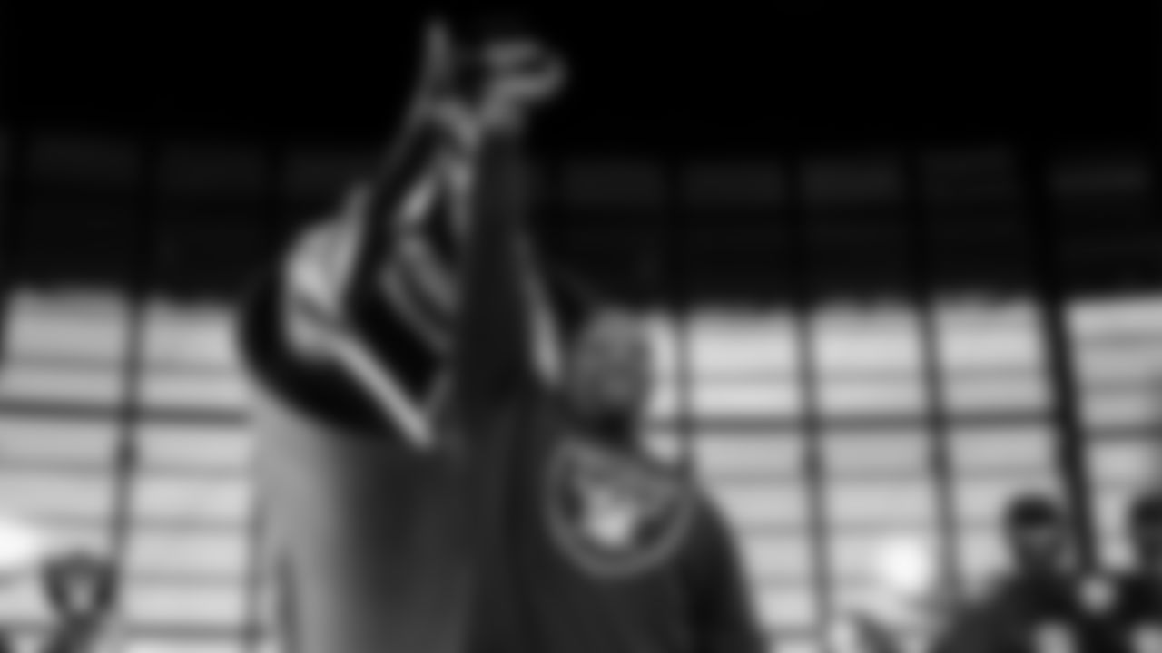 Las Vegas Raiders alumnus Napoleon Kaufman lights the Al Davis Memorial Torch before the Las Vegas Raiders' regular season home game against the Denver Broncos at Allegiant Stadium.