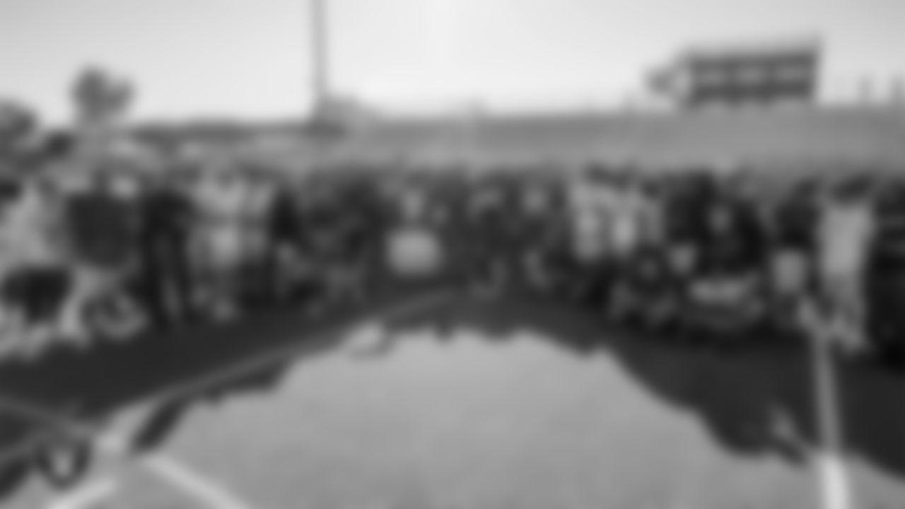 The Desert Oasis High School football team poses for a photo during practice at Desert Oasis High School.