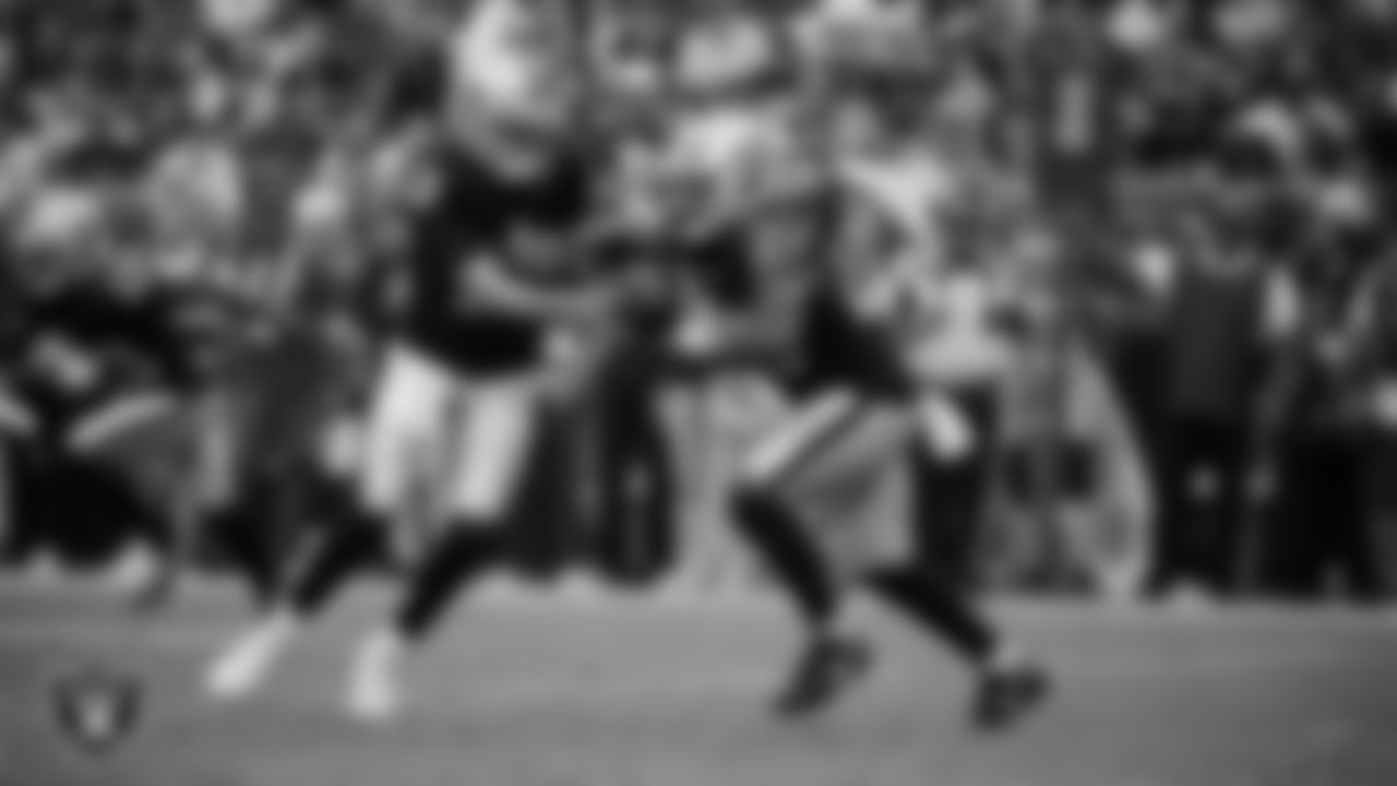 Las Vegas Raiders quarterback Aidan O'Connell (12) hands the ball off to running back Sincere McCormick (28) during the preseason home game against the San Francisco 49ers at Allegiant Stadium.
