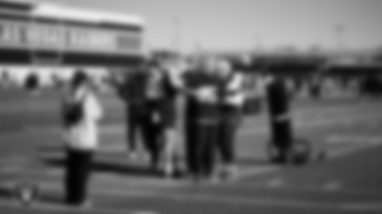The Las Vegas Raiders linebackers huddle during practice at Intermountain Health Performance Center.