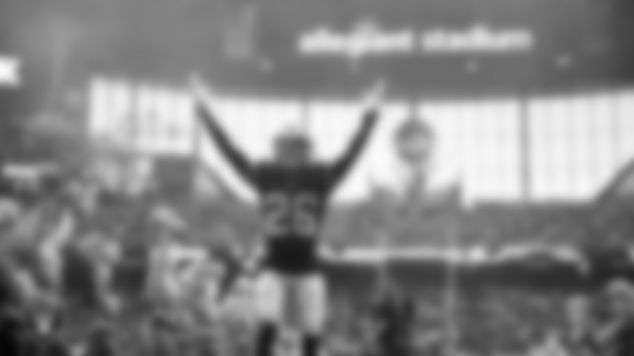 Las Vegas Raiders cornerback Darien Porter (26) is introduced onto the field before the regular season home game against the Denver Broncos at Allegiant Stadium.