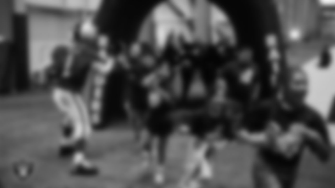 Raider Rusher hypes up students during the Raiders Jr. Training Camp x Camp Bruce Lee event at Intermountain Health Performance Center.