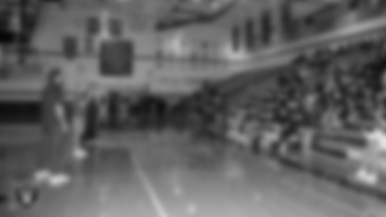 Spanish Springs High School football coach Rob Hummel speaks to his team after being named the Tom Flores Coach of the Year at Spanish Springs High School.