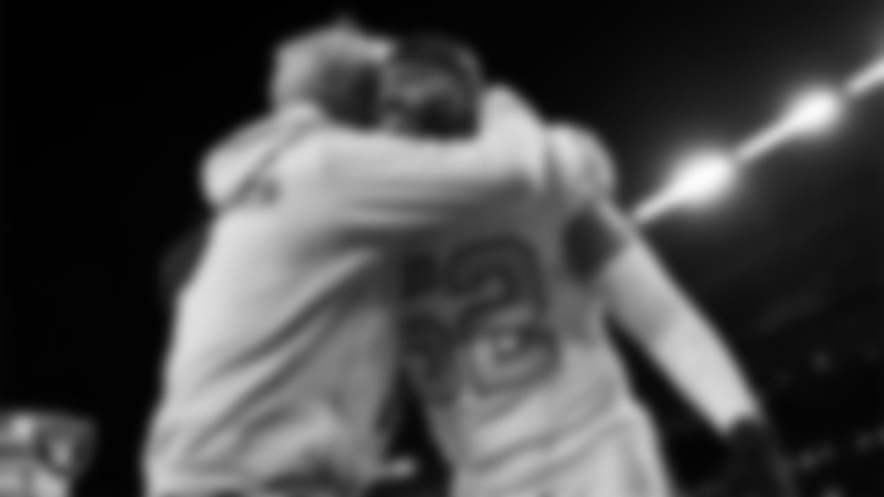 Las Vegas Raiders Head Coach Pete Carroll and linebacker Elandon Roberts (52) before the regular season away game against the Denver Broncos at Empower Field at Mile High.