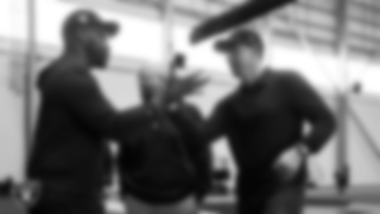 Las Vegas Raiders vice president of player personnel Brandon Hunt and Head Coach Klint Kubiak on the indoor field at Intermountain Health Performance Center.