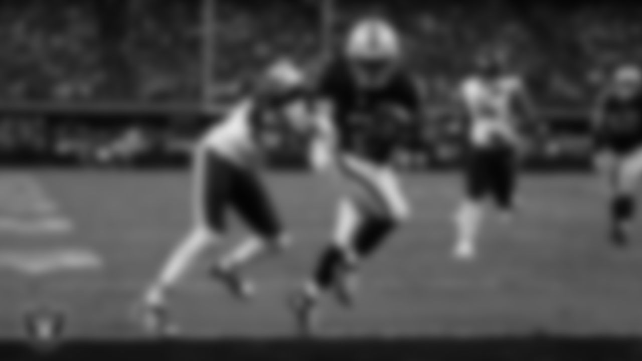 Las Vegas Raiders running back Ashton Jeanty (2) runs after making a 9-yard touchdown catch during the regular season home game against the Chicago Bears at Allegiant Stadium.