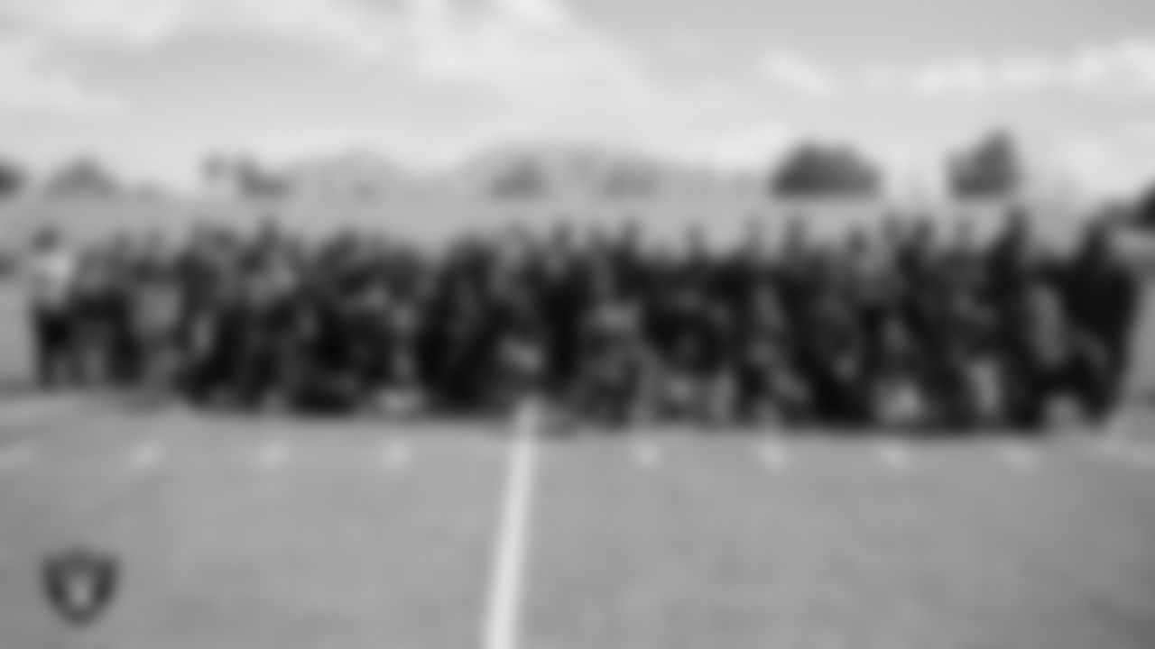 Athletes, peers and coaches pose for a photo during the Special Olympics Nevada Unified Flag Football Competition at Desert Pines High School.
