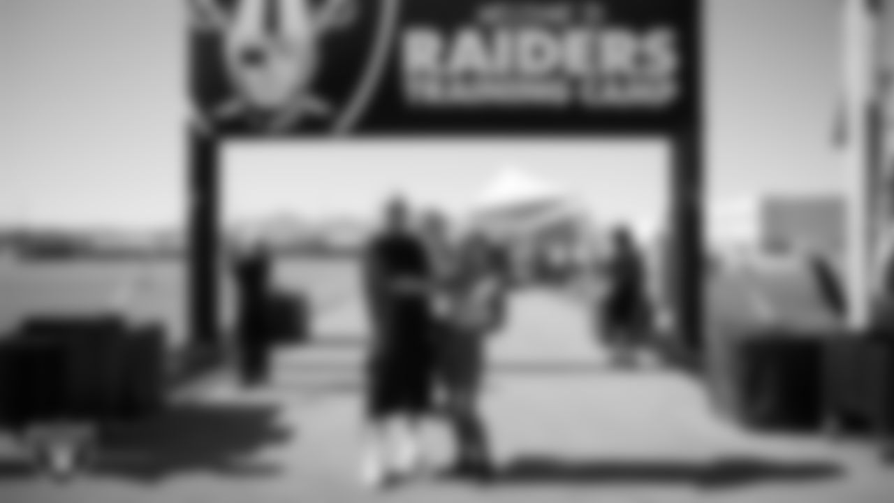 Fans pose for a photo during a 2025 Training Camp practice at Intermountain Health Performance Center.