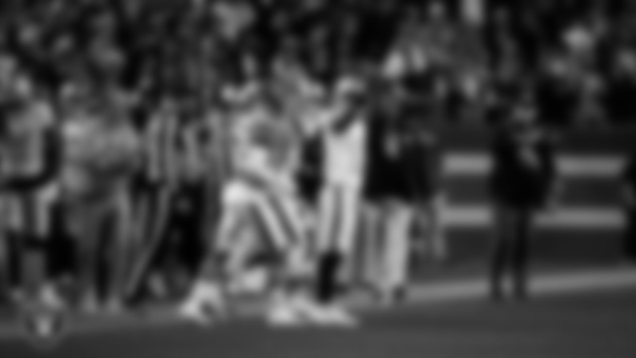 Las Vegas Raiders wide receiver Tyler Lockett (17) celebrates after making a first down during the regular season away game against the Denver Broncos at Empower Field at Mile High.