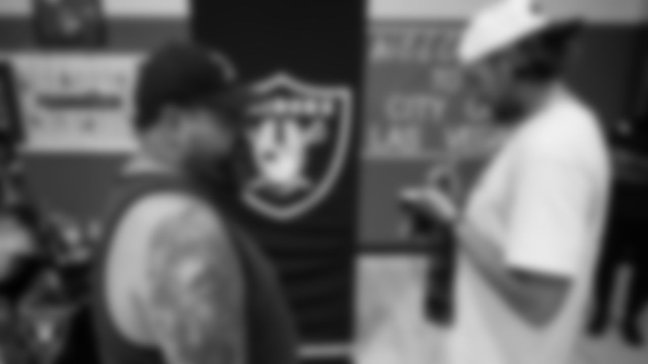 Las Vegas Raiders punter AJ Cole (6) signs autographs after a City of Las Vegas Wheelchair Football League practice at Dula Community Center.