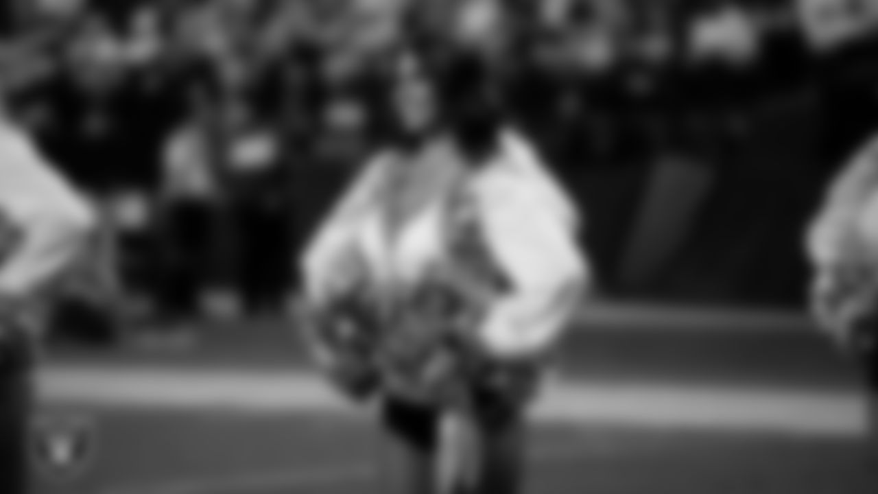 Raiderette Raegen waits to take the field for a performance during the regular season home game against the Dallas Cowboys at Allegiant Stadium.