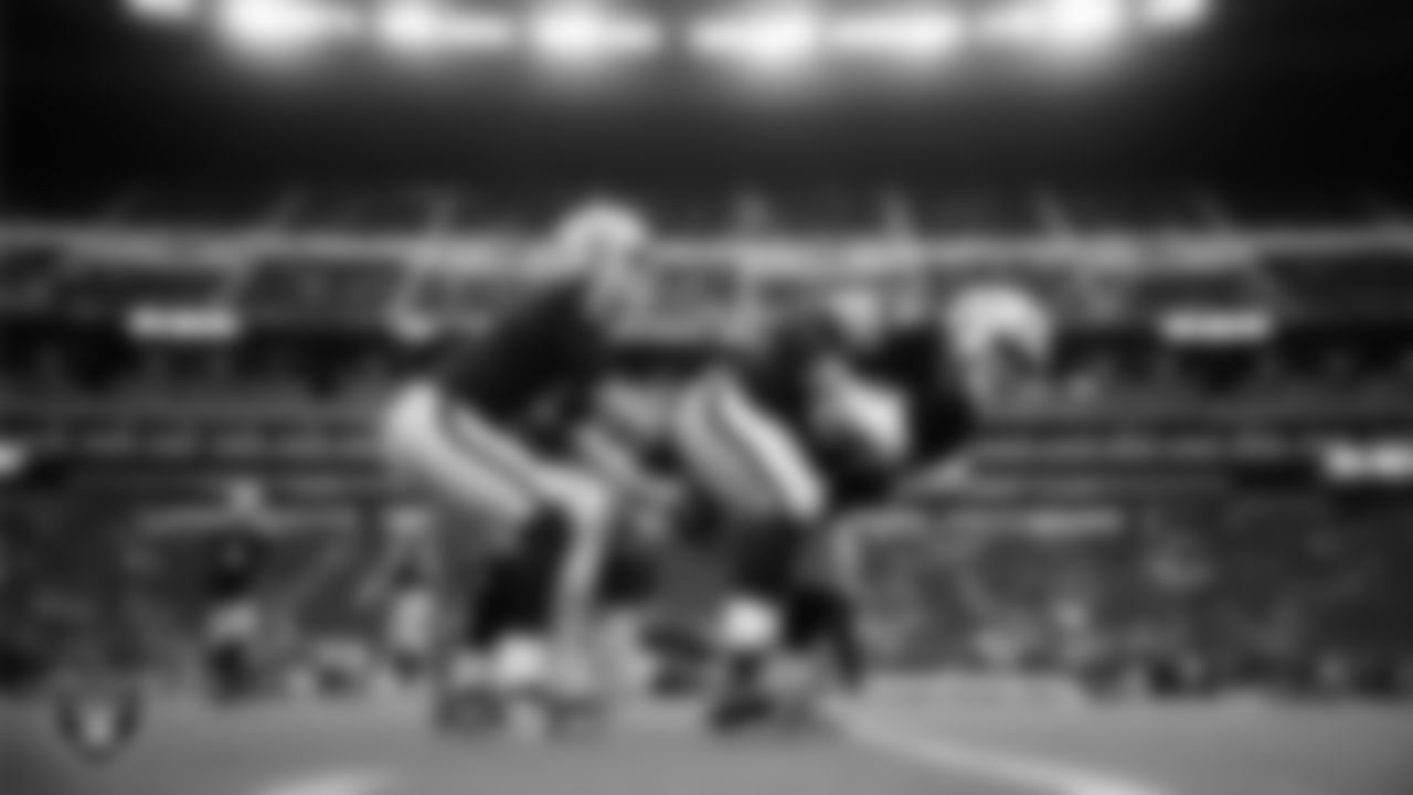 Las Vegas Raiders quarterback Cam Miller (5) and center Jarrod Hufford (64) warming up before the preseason home game against the San Francisco 49ers at Allegiant Stadium.