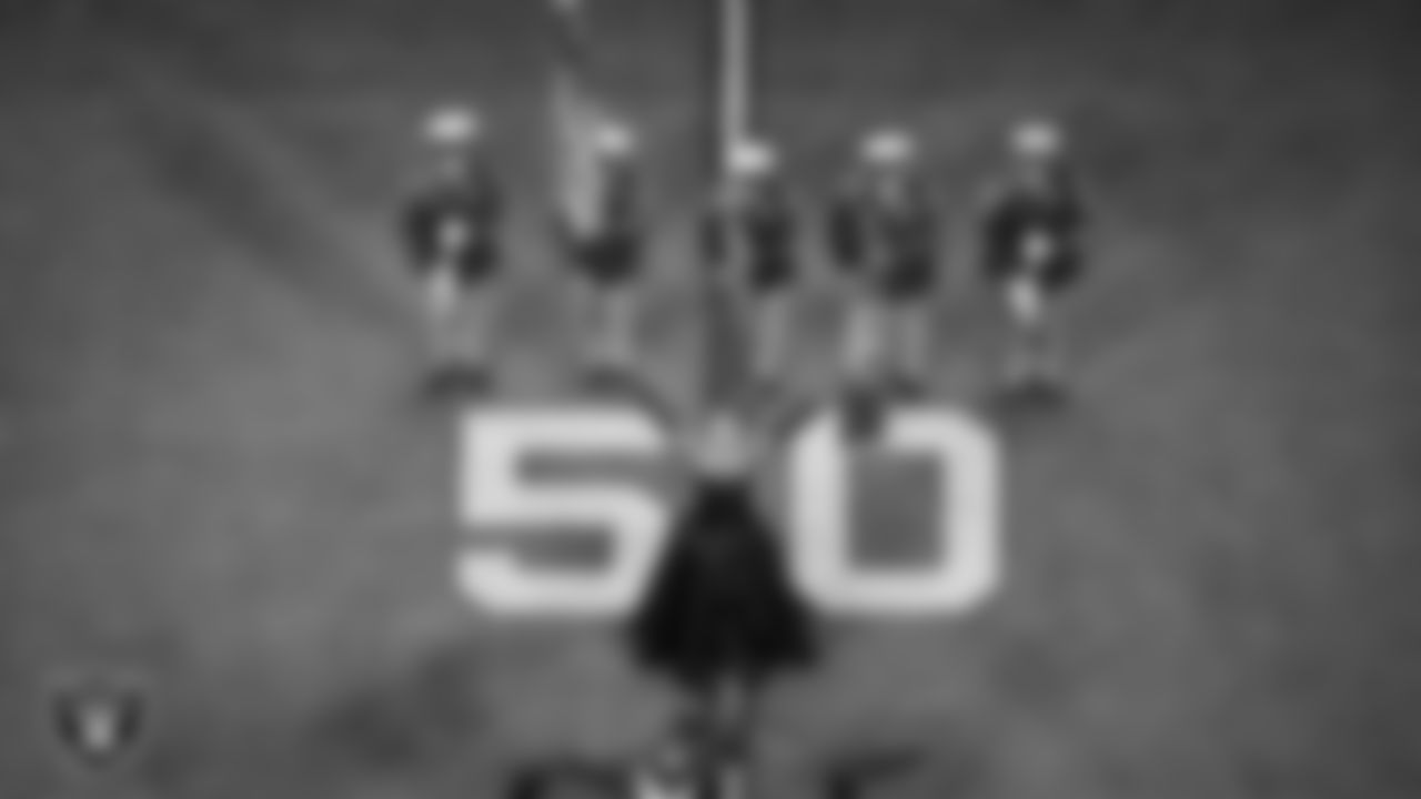 Singer Stephani Parker performs the national anthem while the Las Vegas Metropolitan Police Department Honor Guard presents the nation's colors before the Las Vegas Raiders' regular season home game against the Chicago Bears at Allegiant Stadium.