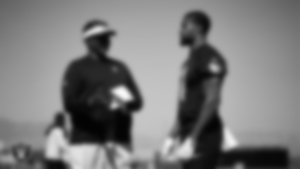 Las Vegas Raiders defensive coordinator Patrick Graham and safety Jeremy Chinn (11) at a workout during phase two of the offseason program at Intermountain Health Performance Center.